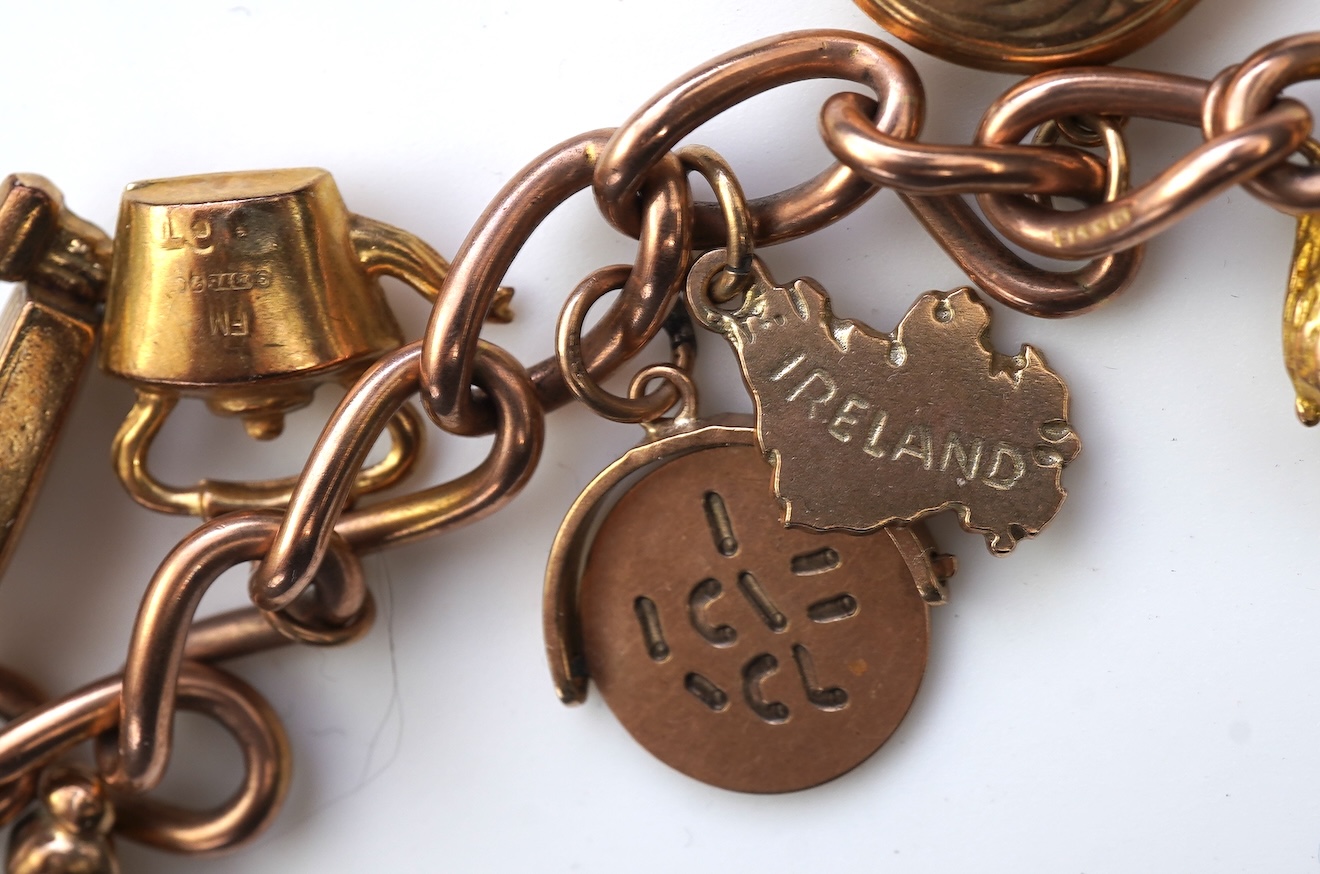 A gold charm bracelet, mid 20th century